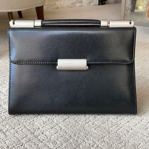 Mandarina Duck black leather purse.